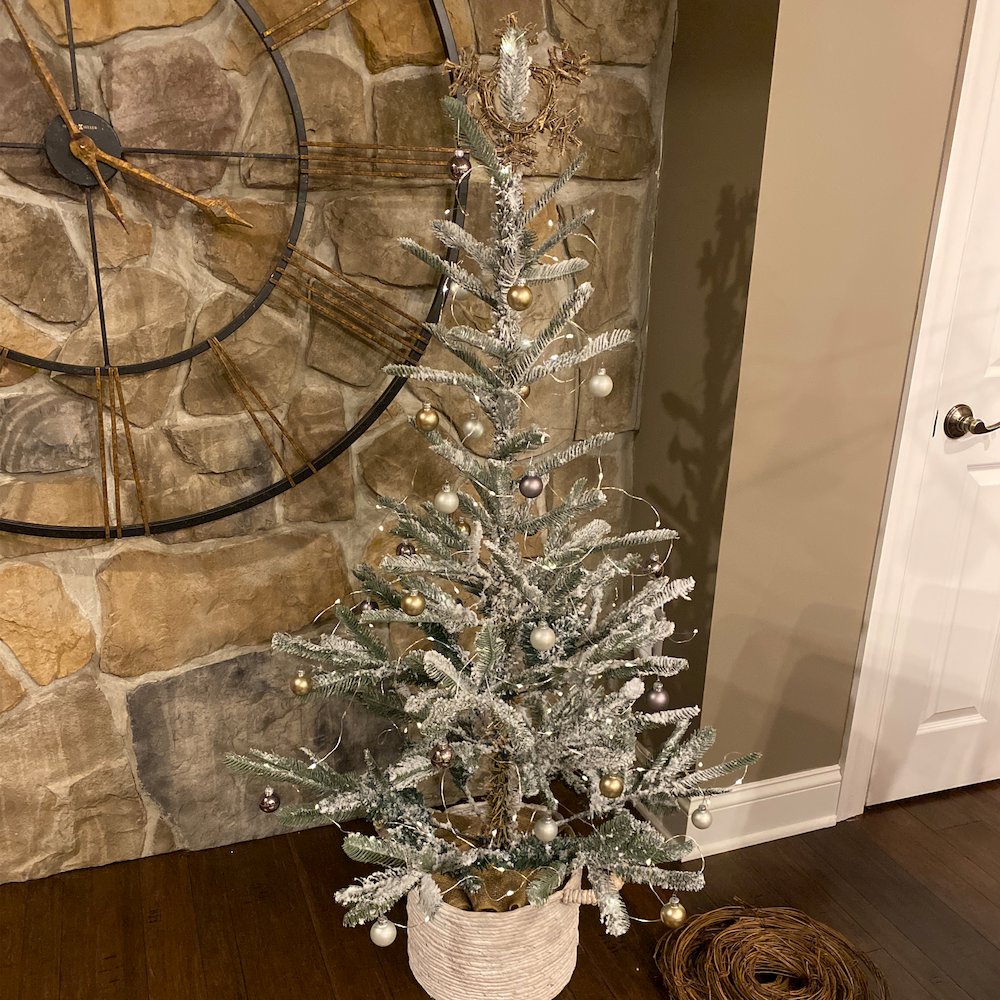 4.5' Green Flocked Nordmann Fir Artificial Christmas Tree - Unlit. Picture 6