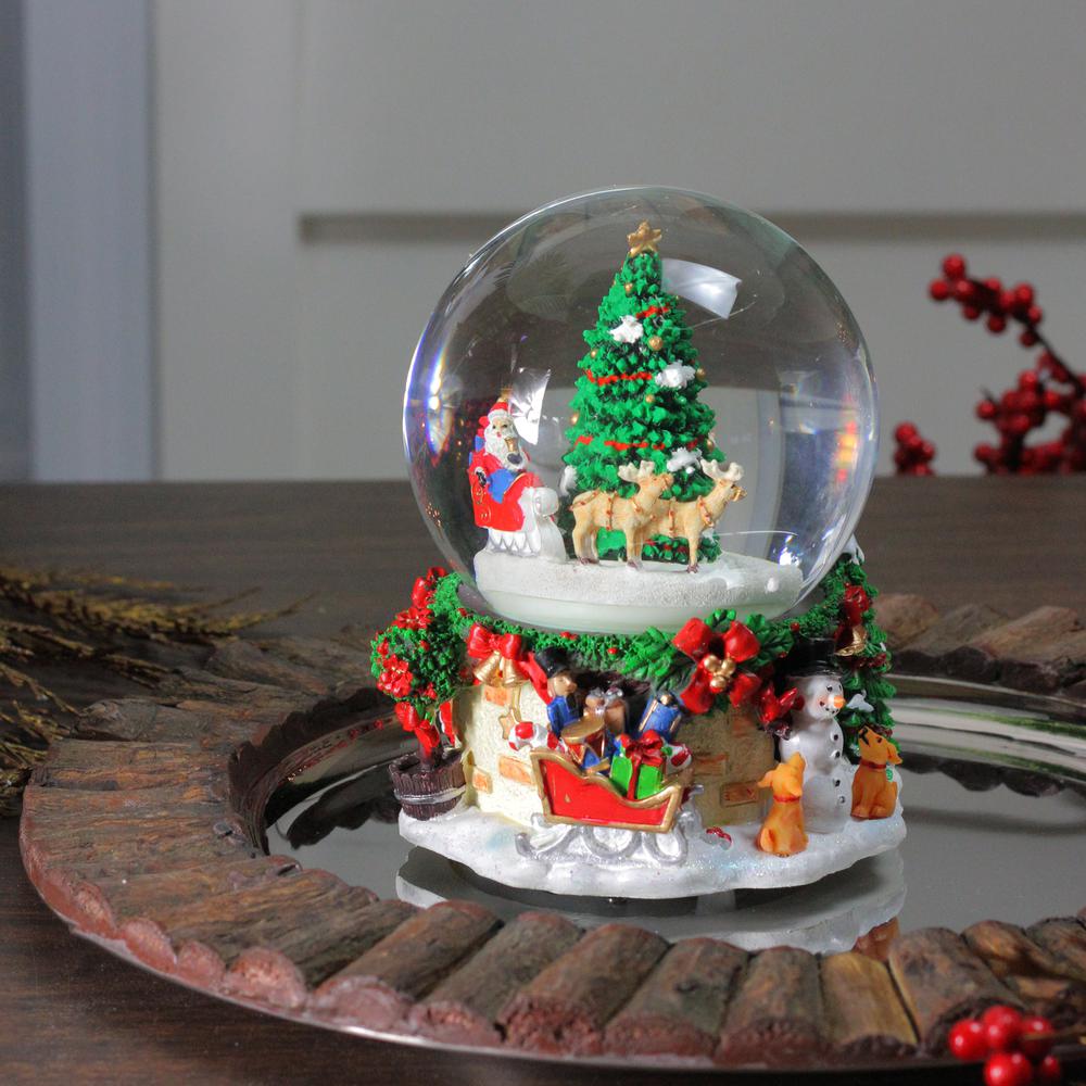 6.5" Musical and Animated Santa on Sleigh Rotating Christmas Snow Globe. Picture 3