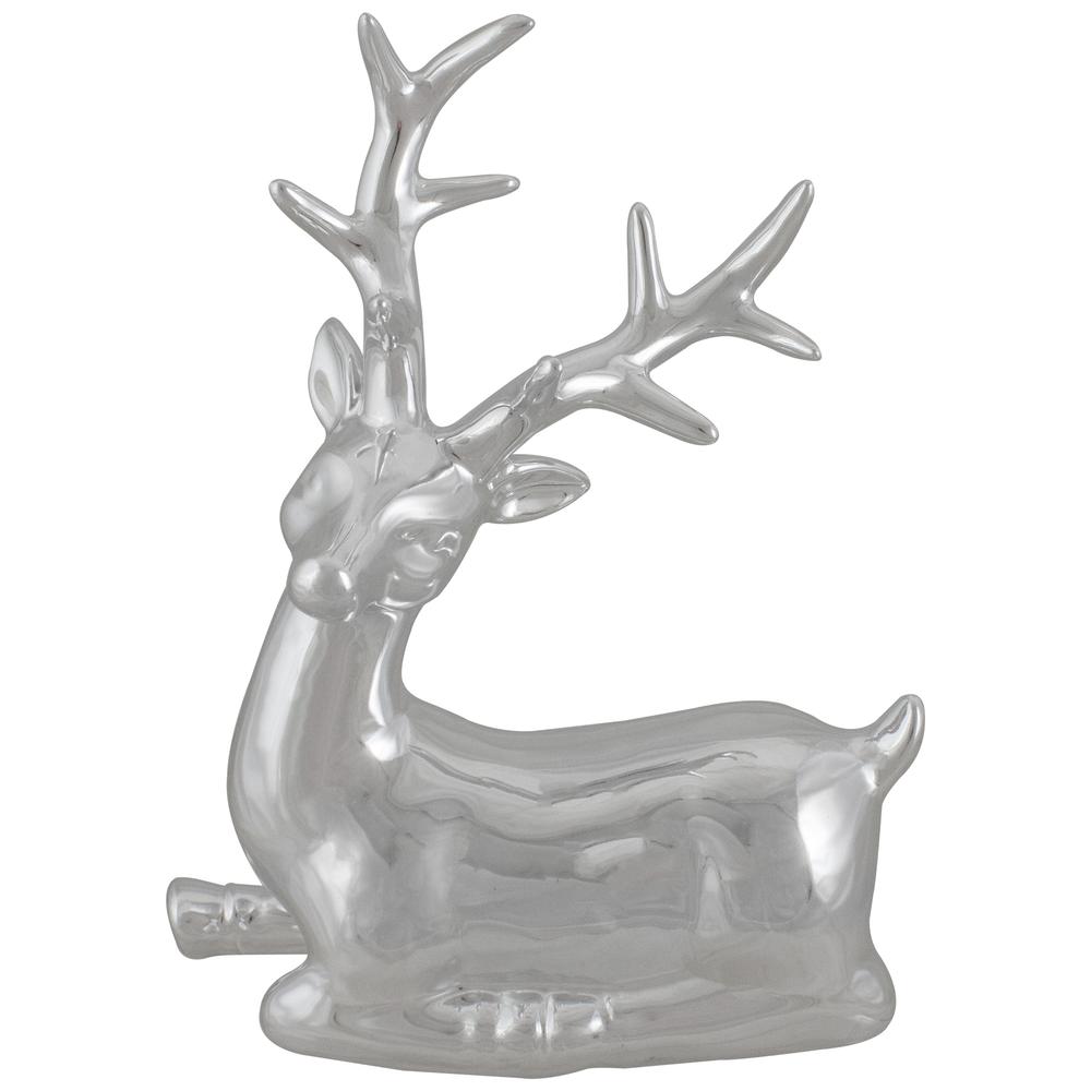 10" Metallic Silver Sitting Reindeer Christmas Tabletop Decor. Picture 1