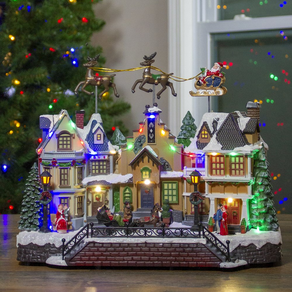 LED Lighted and Animated Christmas Village with Flying Sleigh Decoration - 16". Picture 2