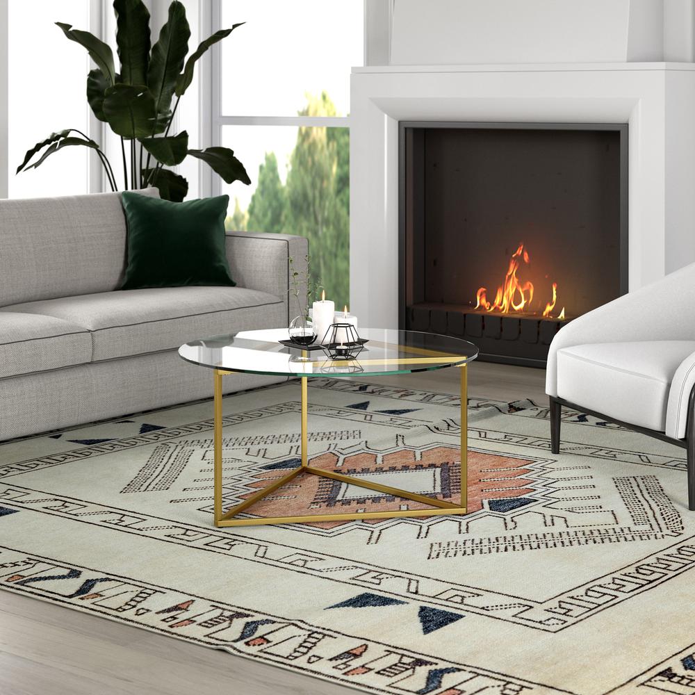 Jenson 35'' Wide Round Coffee Table with Glass Top in Brass. Picture 4