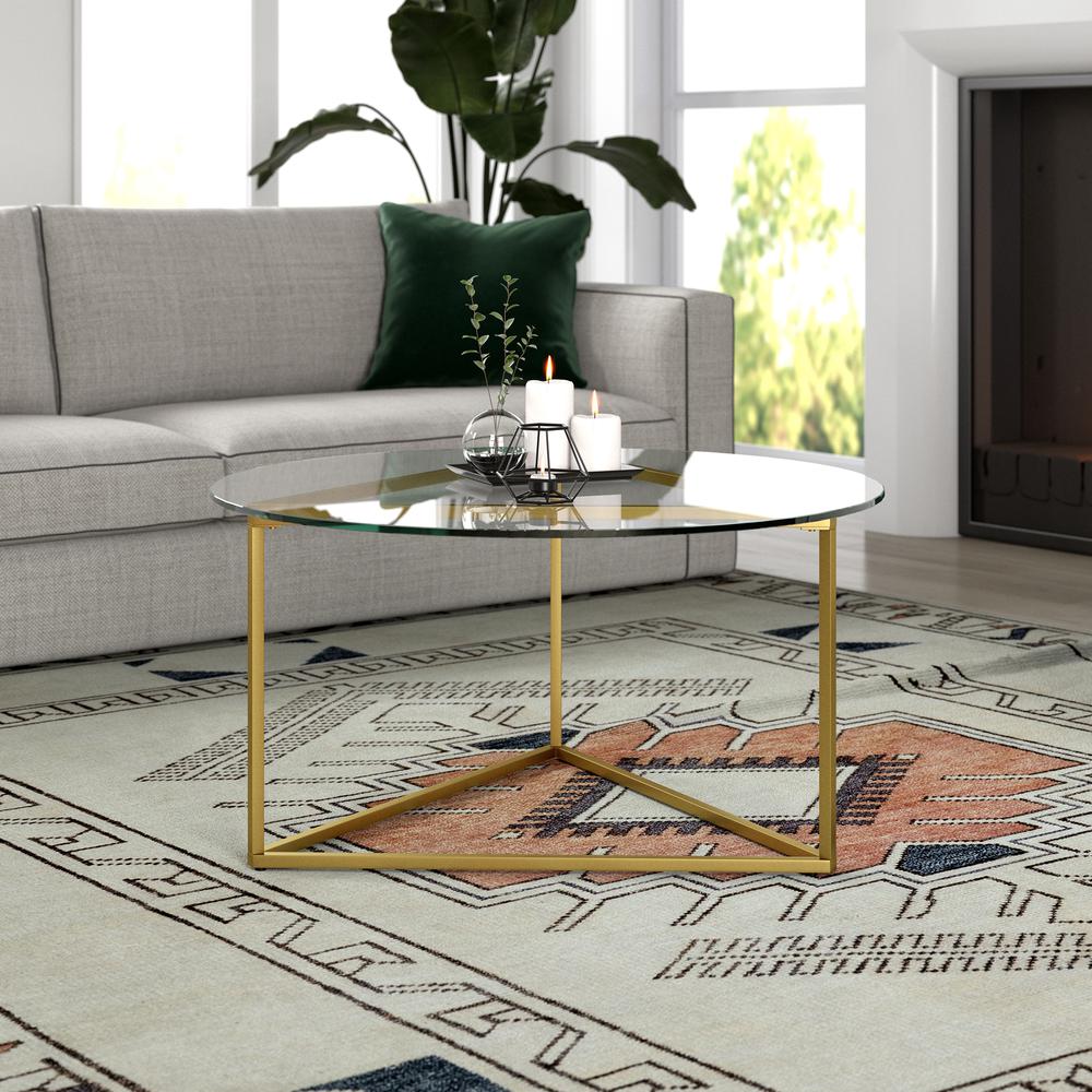 Jenson 35'' Wide Round Coffee Table with Glass Top in Brass. Picture 2