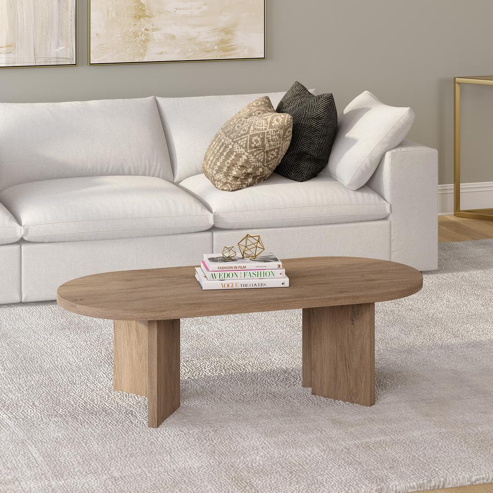 Alma 48" Wide Oval Coffee Table in Antiqued Gray Oak. Picture 3