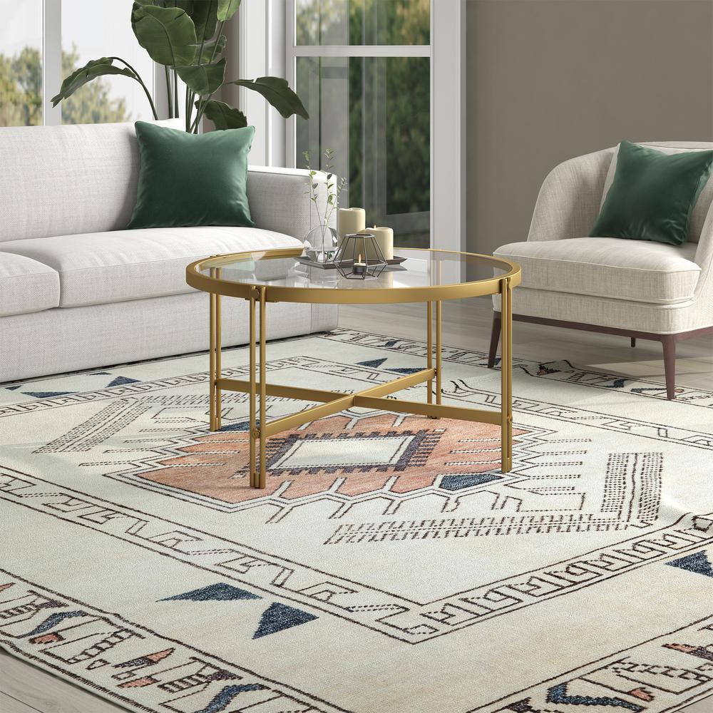 Inez 32" Wide Round Coffee Table in Brass. Picture 4