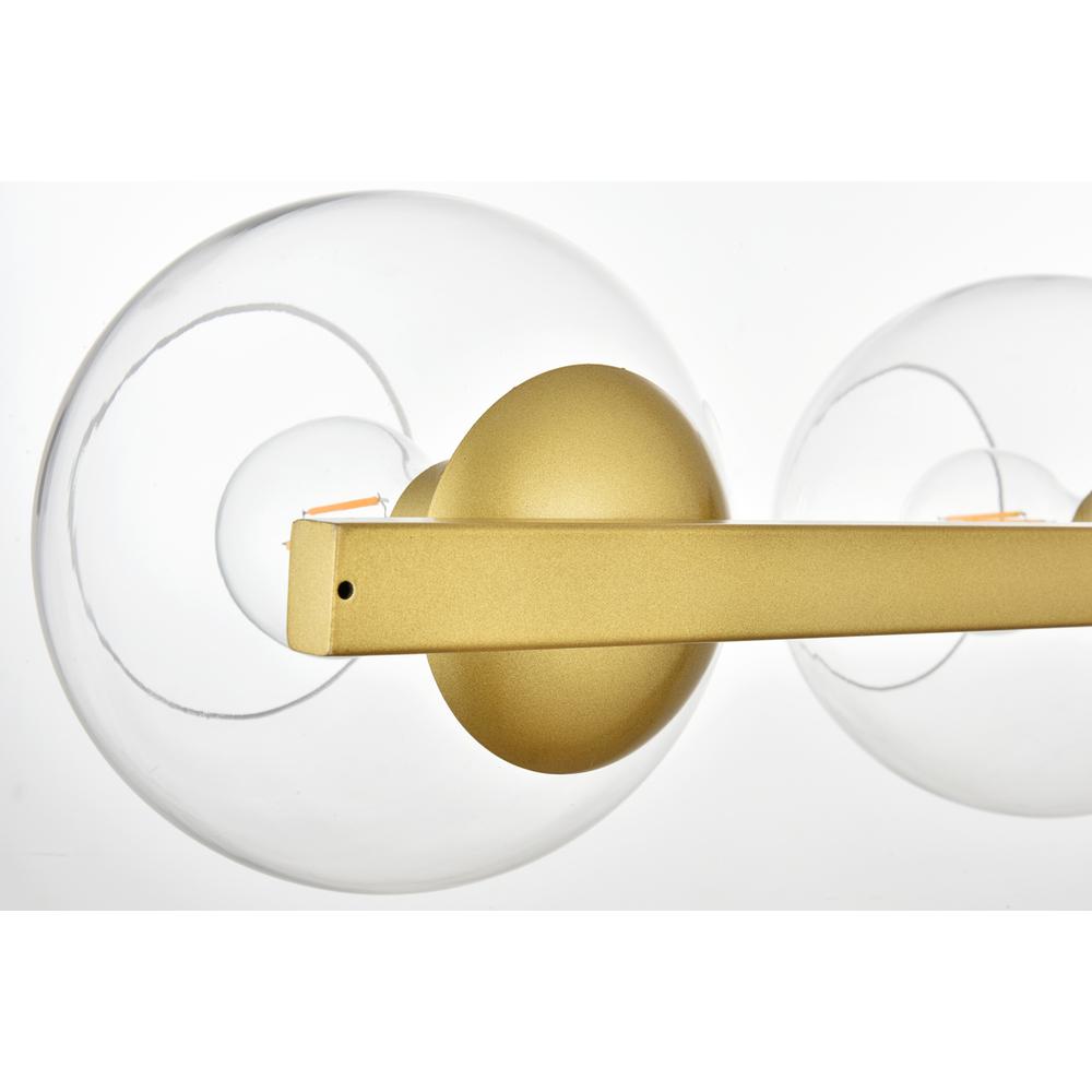 Rogelio 4 light Brass and Clear Bath Sconce. Picture 3