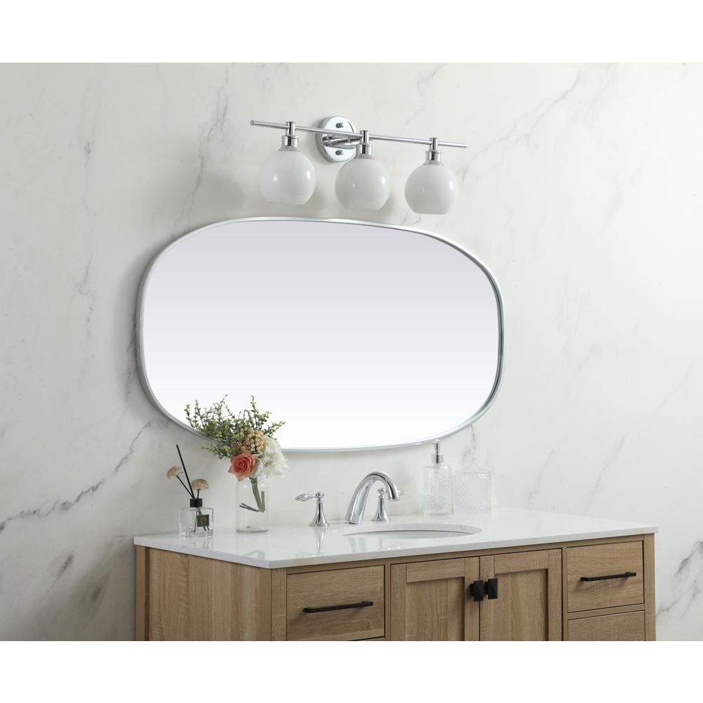Metal Frame Oval Mirror 24x48 Inch in Silver. Picture 2