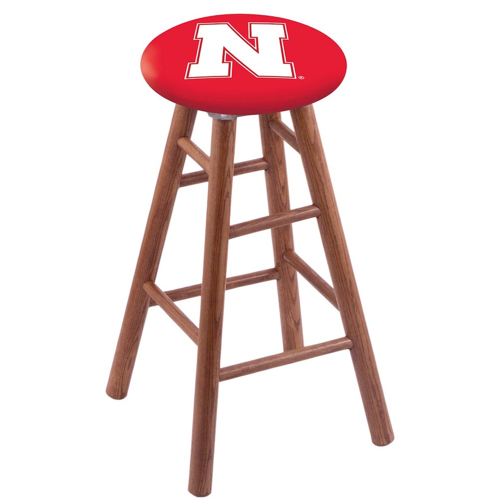 Oak Extra Tall Bar Stool in Medium Finish with Nebraska Seat. Picture 1