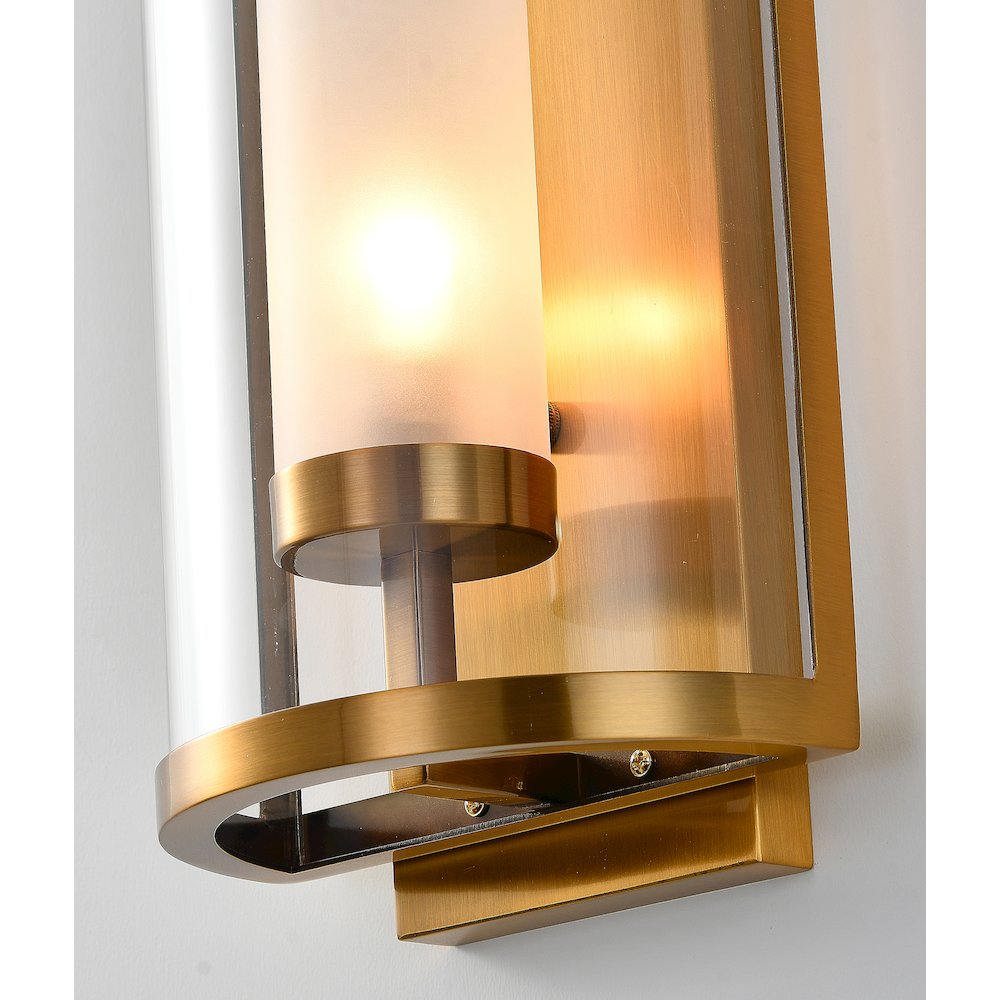 1-Light Antique Brass Metal Wall Sconce With A Clear Glass Shade. Picture 2