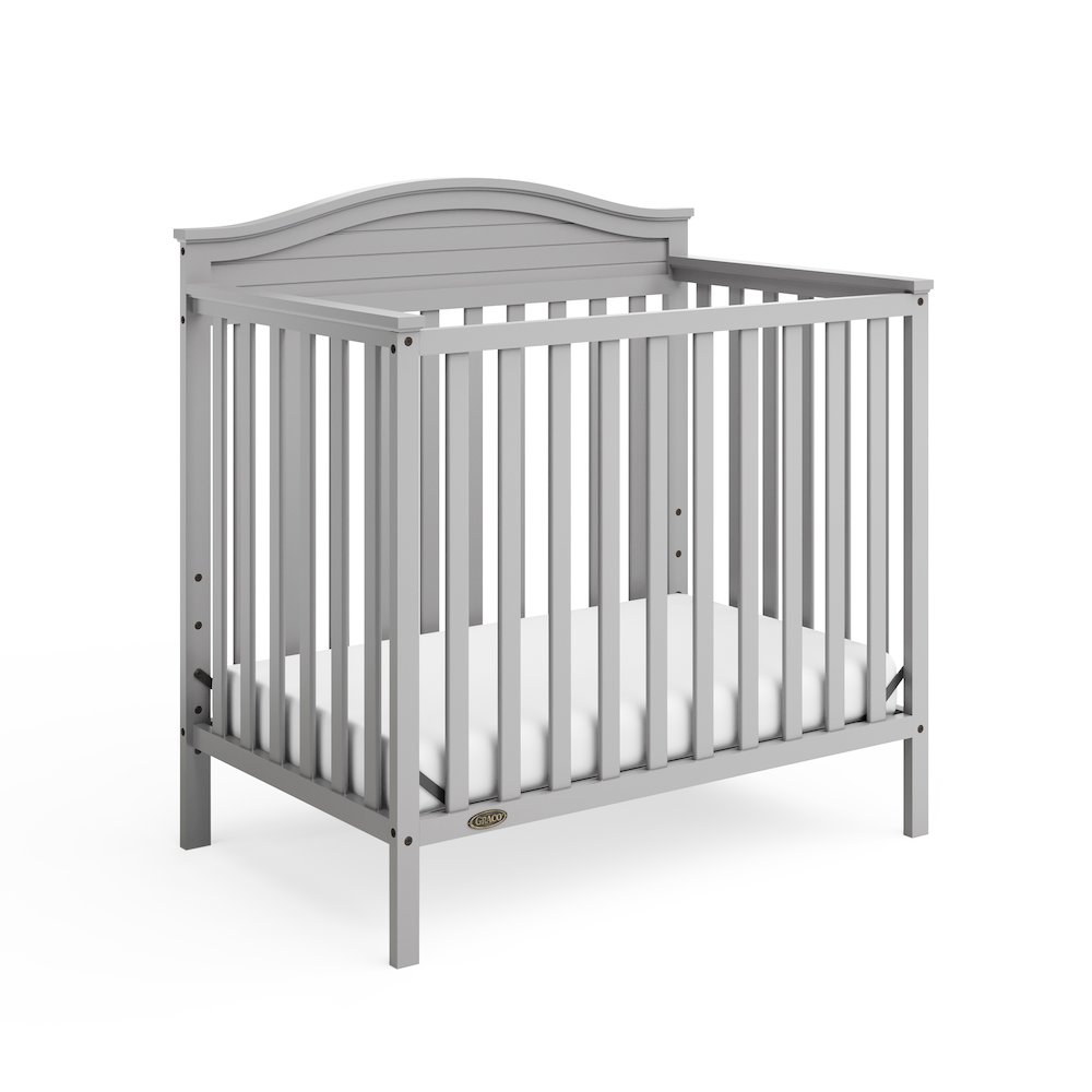 Graco Stella 4-in-1 Convertible Mini Crib with Bonus Mattress - Pebble Gray. Picture 1