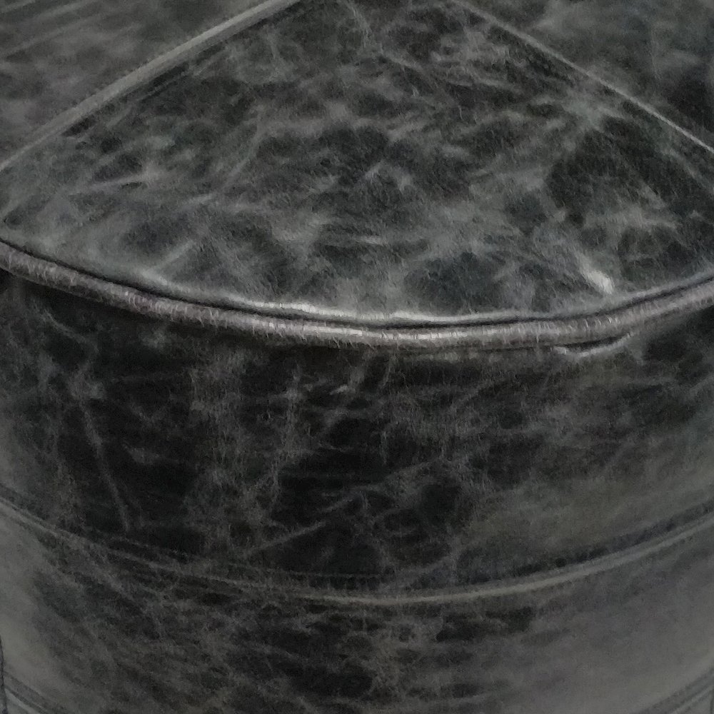 Connor Round Pouf In Distressed Black Genuine Leather. Picture 2