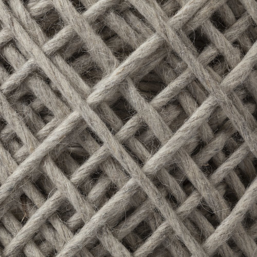 Allium Oatmeal Handwoven Wool Cylindrical Pouf. Picture 4