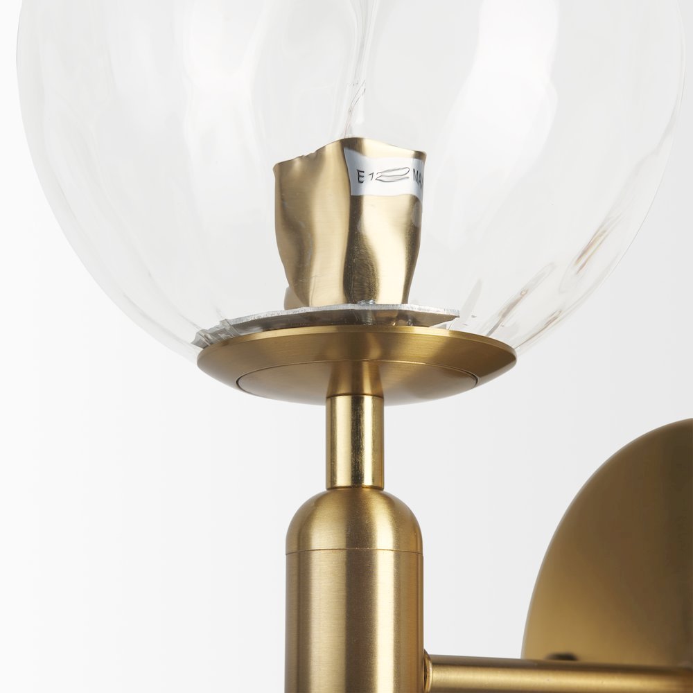 Britton Gold Metal w/ Clear Glass Globe 1-Light Wall Sconce. Picture 3