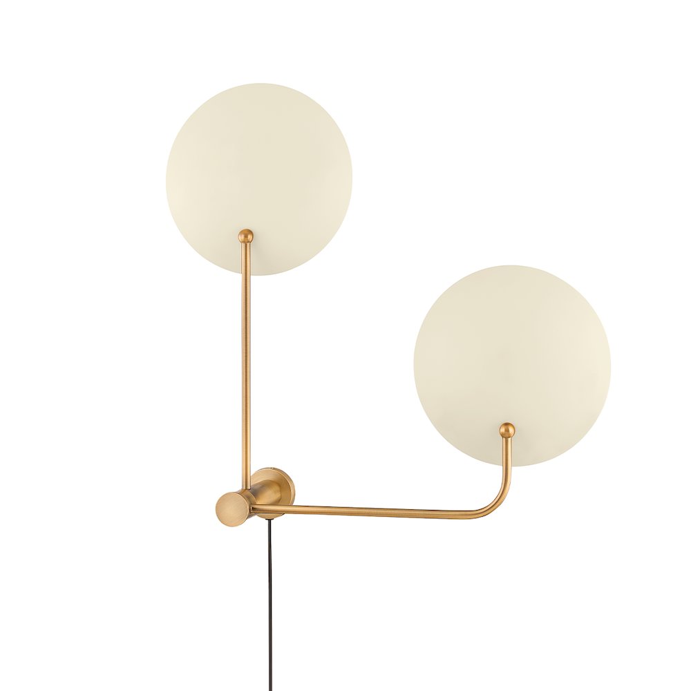 Leif Plug-In Sconce In Patina Brass And Soft Sand Color. Picture 1
