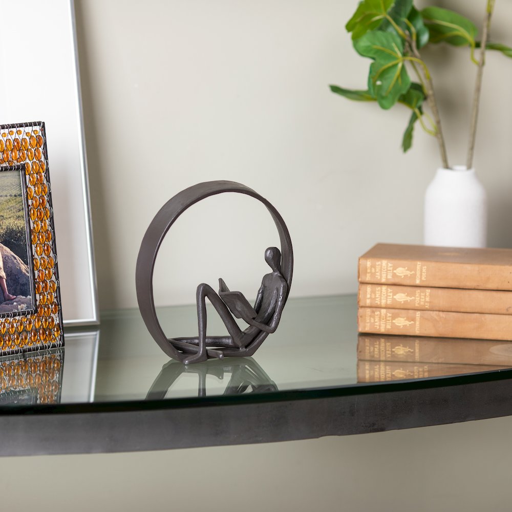 Encircled Reader Iron Sculpture. Picture 4