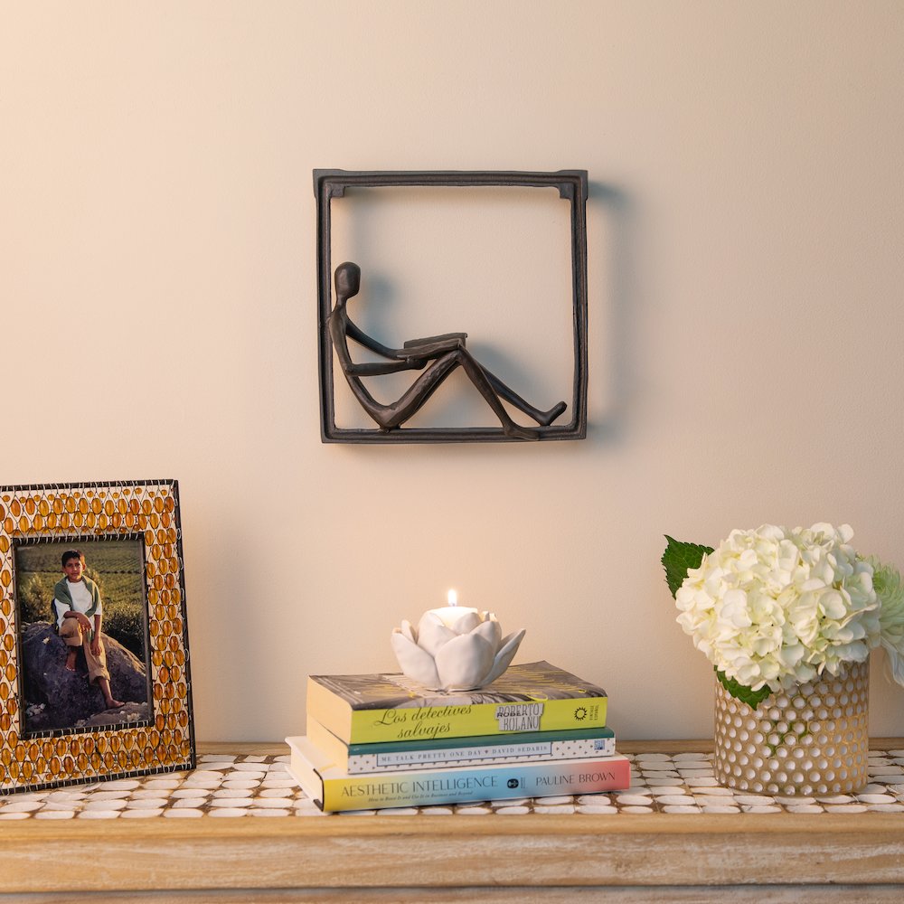 Man Reading on a Window Sill Hanging Wall Art Iron Sculpture. Picture 3