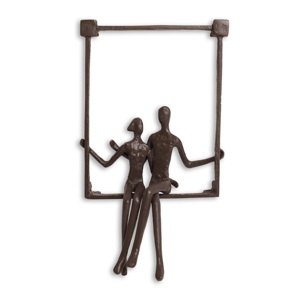 Couple Sitting on a Window Seal Iron Wall Piece. Picture 1