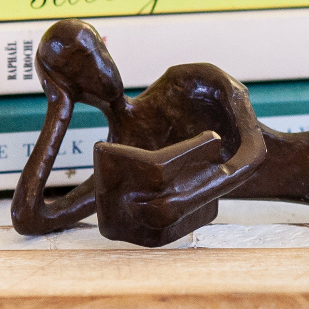 Man and Woman Leisurely Reading a Book Bronze Sculptures (2 piece set). Picture 3
