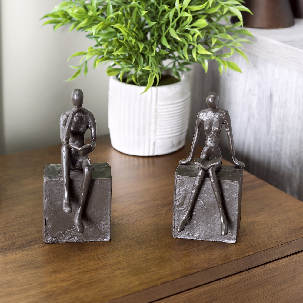 Man and Woman Reading on a Block Cast Iron Bookend Set. Picture 2