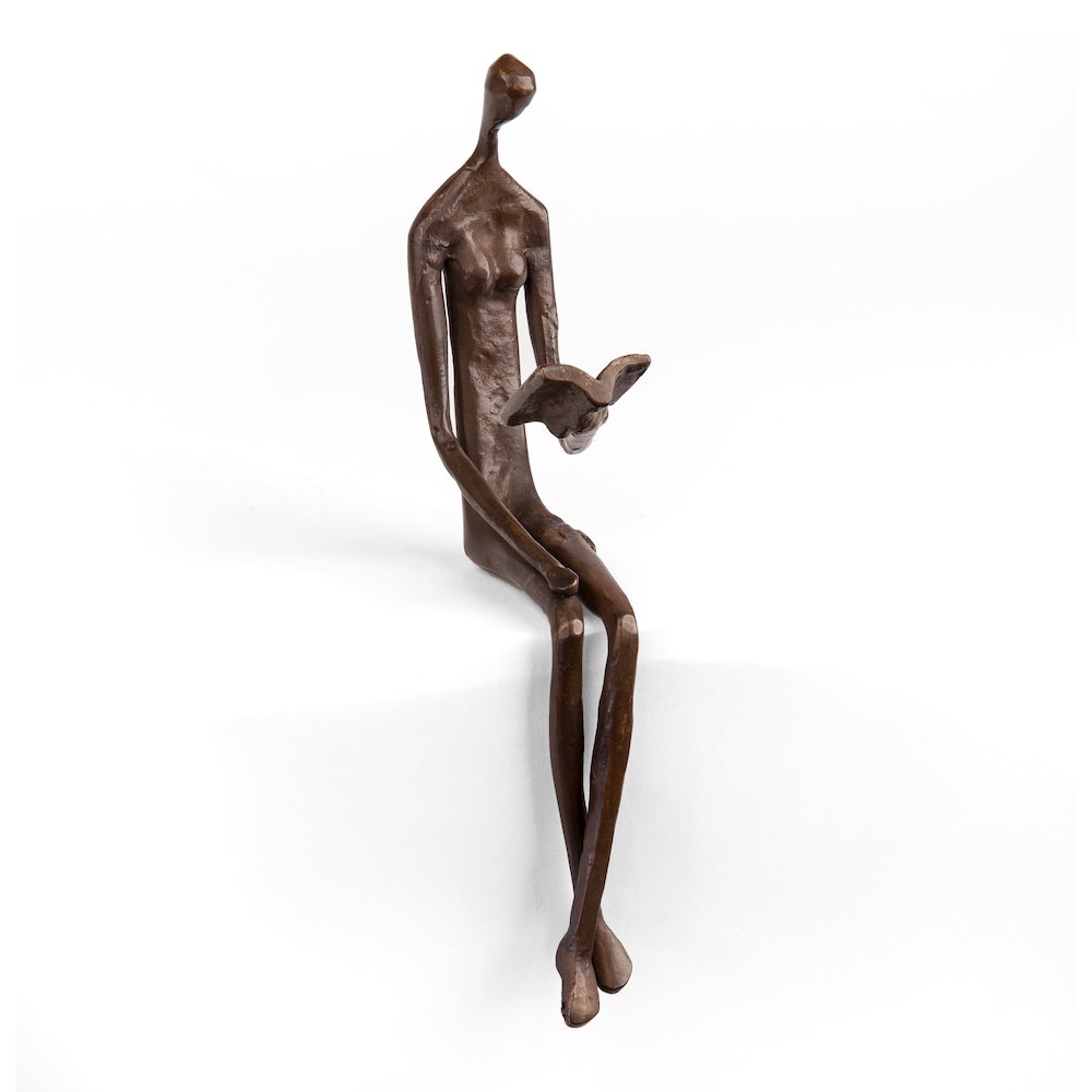 Woman Reading Over Ledge Cast Bronze. Picture 1