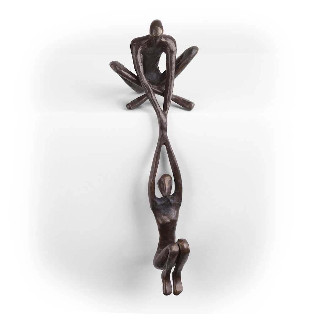 Man Lifting Woman from Ledge Bronze Sculpture. Picture 1