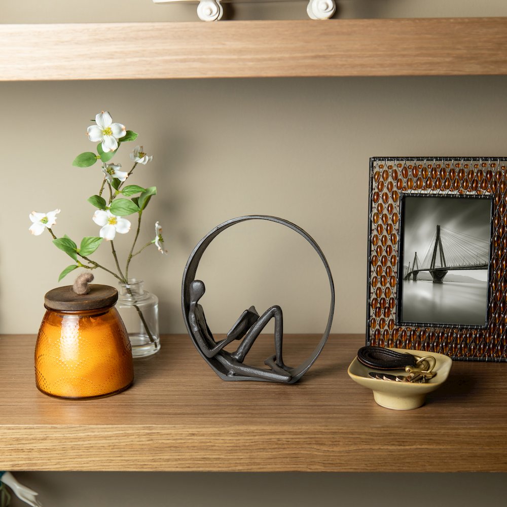 Encircled Reader Iron Sculpture. Picture 3