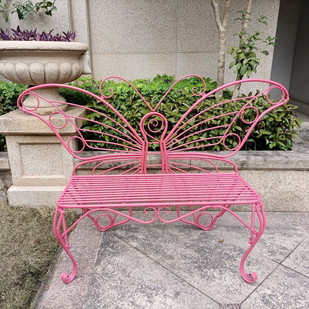 Pink Metal Butterfly Bench: Enchanting Outdoor Charm. Picture 2