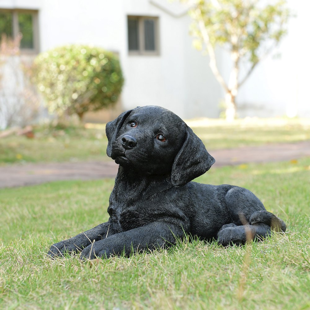 Midnight Reverie: Sleek Black Polyresin Lying Labrador Figurine. Picture 2