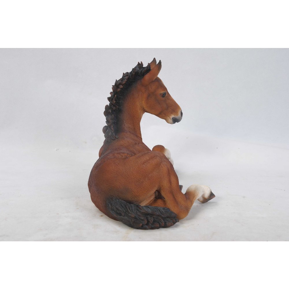 Horse Colt Laying Down Statue. Picture 1