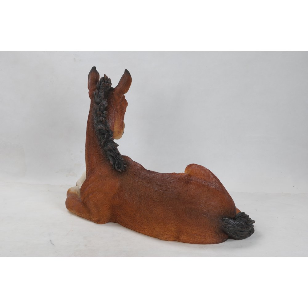 Large Horse Colt Laying Down Statue. Picture 1