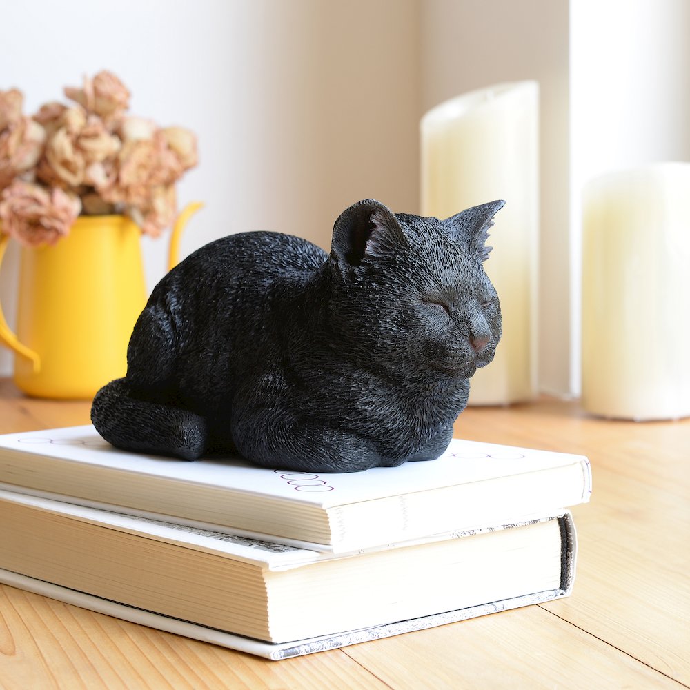 Serenity Snooze: Chic Black Polyresin Napping Cat Figurine. Picture 2
