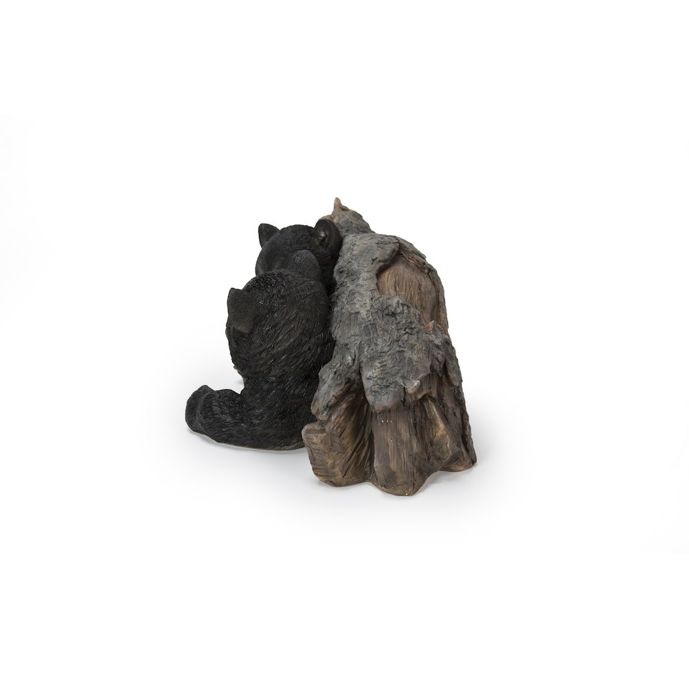 Black Bear Cubs Hiding Under Log Statue. Picture 1