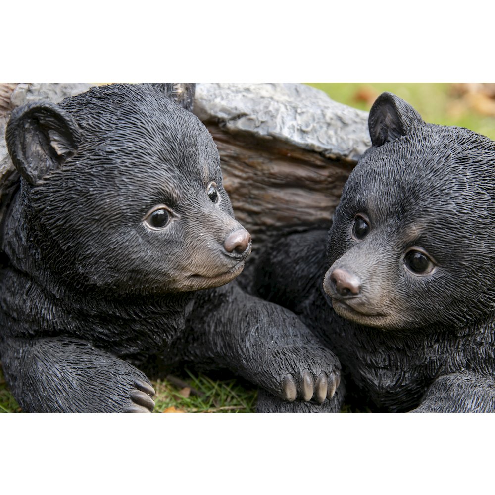 Black Bear Cubs Hiding Under Log Statue. Picture 5