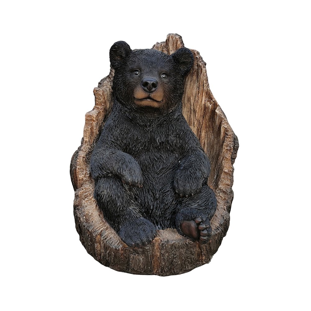 Lone Cub Haven: Intriguing Black Polyresin Bear in Stump Figurine. Picture 1