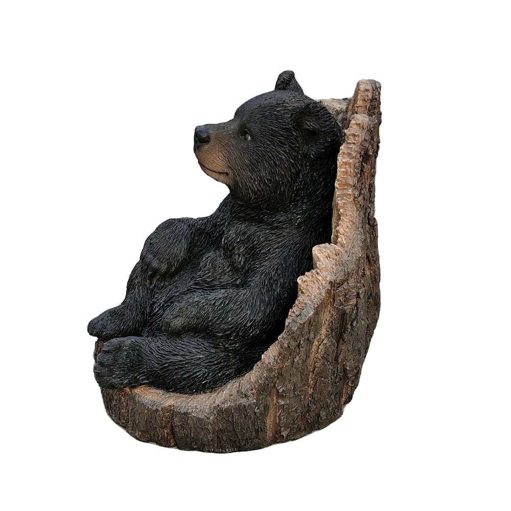 Lone Cub Haven: Intriguing Black Polyresin Bear in Stump Figurine. Picture 4
