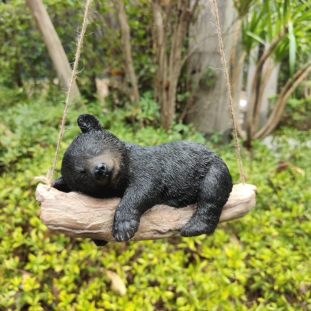 Suspended Cub Serenity: Striking Black Hanging Bear Polyresin Figurine. Picture 2