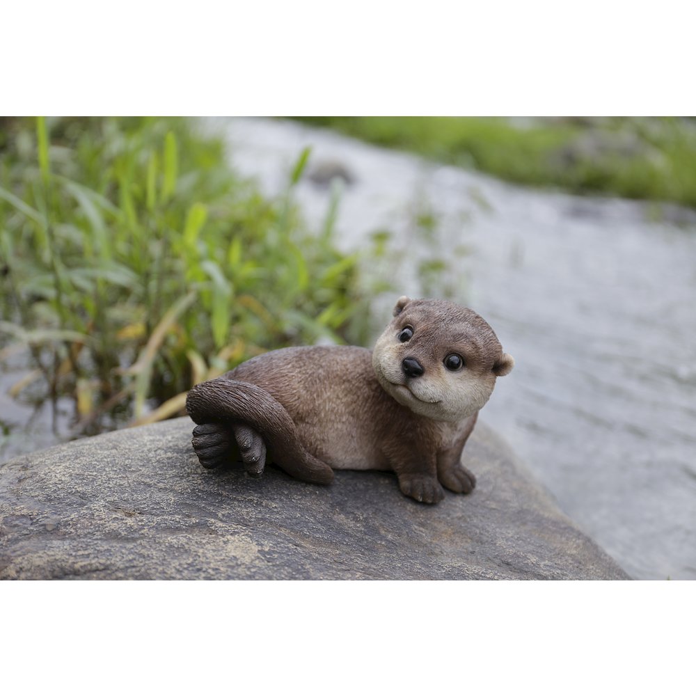 Otter Laying Back Statue. Picture 7