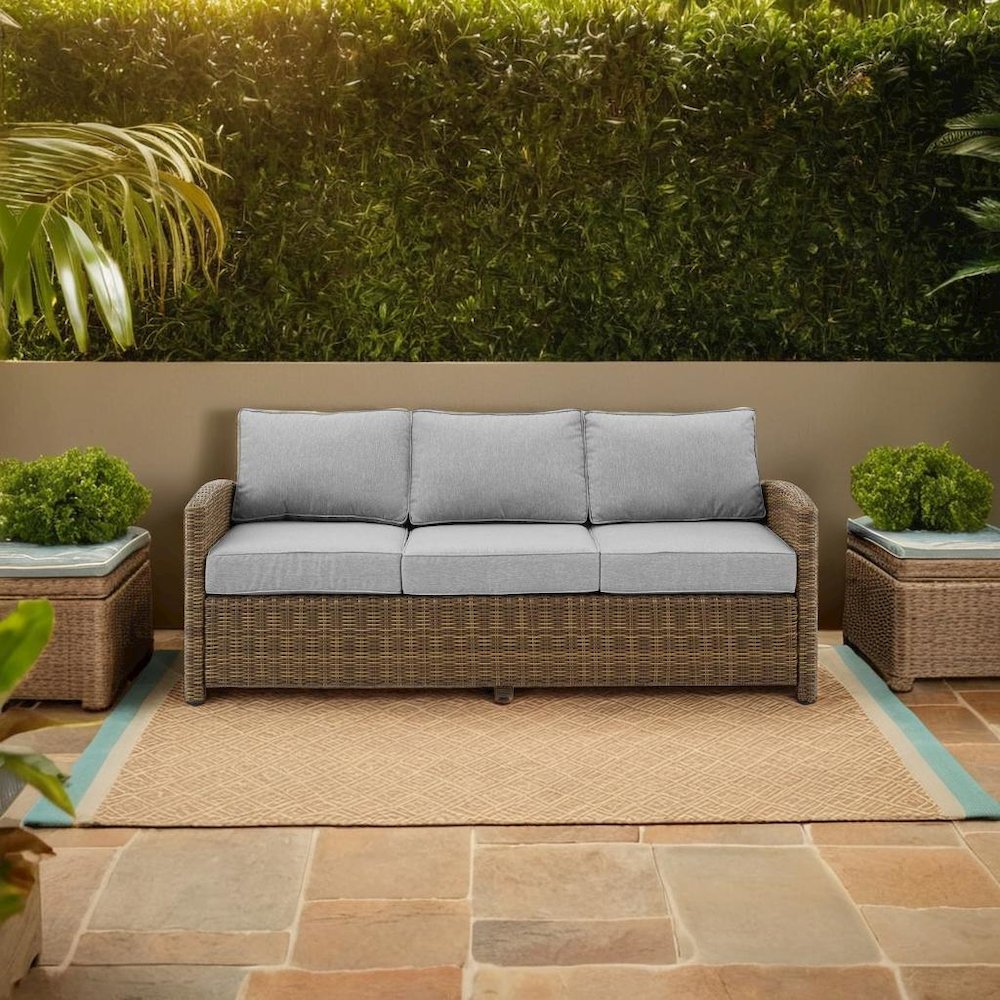 Elegant Gray Wicker Outdoor Sofa with Weather-Resistant Cushion Covers. Picture 5